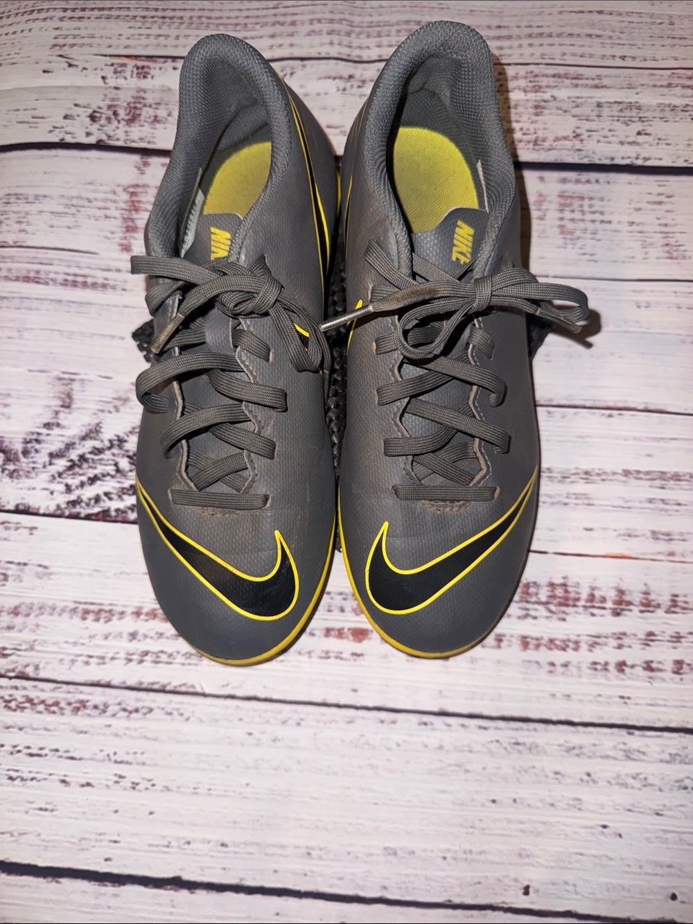 Nike Youth Gray soccer cleats with Yellow Accents